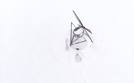 old windmill in estonian winter landscapeの写真素材