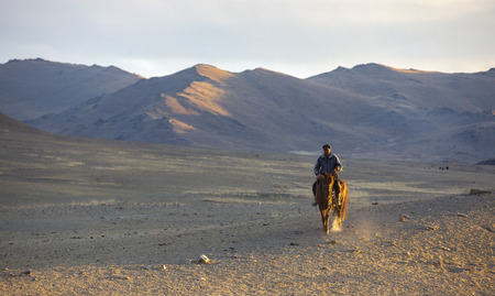 bayan Ulgii, Mongolia, 2nd October 2015: rider in a landscape of Western Mongoliaの写真素材