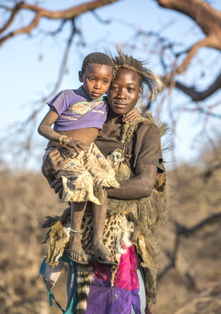 Lake Eyasi, Tanzania, 11th September 2019: Hadzabe man with his kid