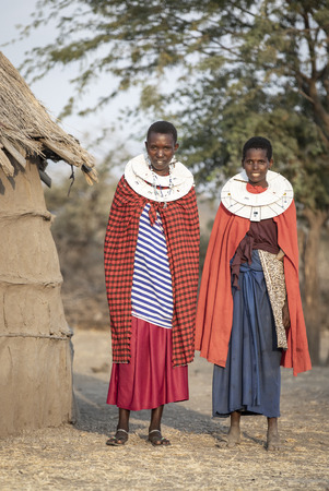 Arusha, Tanzania, 7th September 2019: beautiful maasai women in traditional clothing, wearing full jewelryのeditorial素材