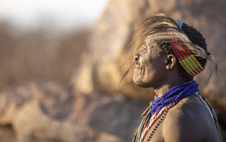 Lake Eyasi, Tanzania, 11th September 2019: Hadzabe man resting with his bow and arrowのeditorial素材