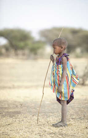 Arusha, Tanzania, 7th September 2019: maasai kid in a savannahのeditorial素材