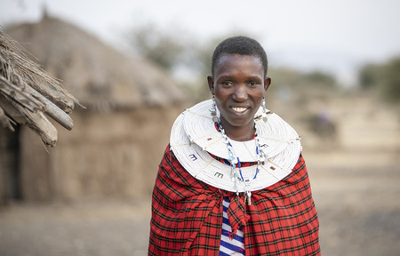 Arusha, Tanzania, 7th September 2019: beautiful maasai women in traditional clothing, wearing full jewelryのeditorial素材