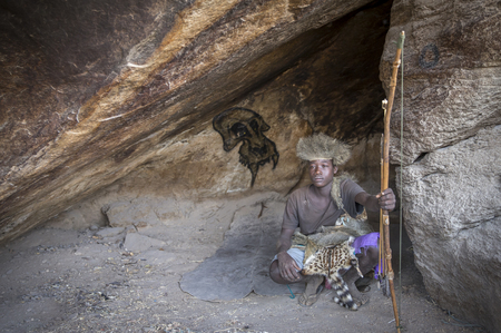 Lake Eyasi, Tanzania, 11th September 2019: Hadzabe man in a cave