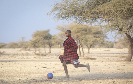 Arusha, Tanzania, 7th September 2019: maasai warriors playing soccerのeditorial素材