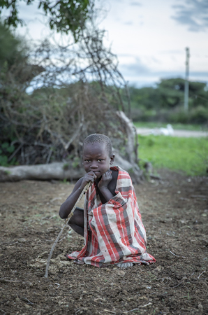 Same, Tanzania, 4th June, 2019:  Maasai boy in his home boma (village)のeditorial素材