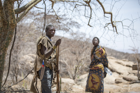 Lake Eyasi, Tanzania, 11th September 2019: Hadzabe man talking to his woman