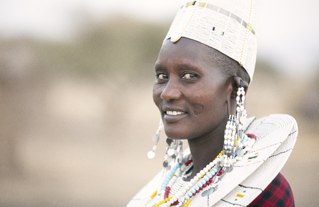 Arusha, Tanzania, 7th September 2019: beautiful maasai women in traditional clothing, wearing full...