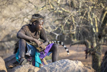 Lake Eyasi, Tanzania, 12th September 2019: Hadzabe man in traditional clothing in a nature where he livesのeditorial素材
