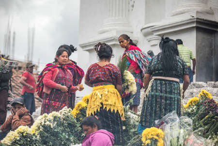 chichicastenango, Guatemala, 27th February 2020: mayan people at the traditional market selling and buying craftsのeditorial素材