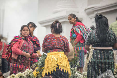 chichicastenango, Guatemala, 27th February 2020: mayan people at the traditional market selling and buying craftsのeditorial素材