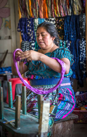 Lake Atitaln, Guatemala, 26th february 2020: mayan woman preparing yarns to weave traditional fabricsのeditorial素材