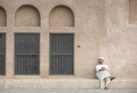 arab man in traditional clothing in historic Shindagha district of Dubaiの写真素材