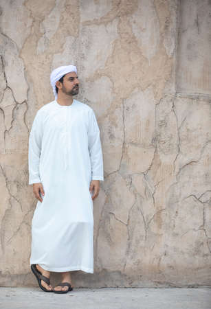 arab man in traditional clothing  in historic Shindagha district of Dubai