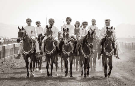 Ibri, Oman, 28th April 2018: omani men racing horses to celebrate Eidのeditorial素材