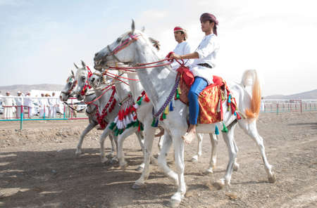 Ibri, Oman, 28th April 2018: omani men racing horses to celebrate Eidのeditorial素材