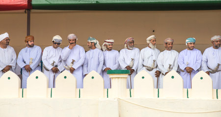 khadal, Oman,28th April 2018: omani men in traditional clothing, watchin a horse raceのeditorial素材