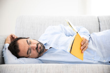 middle aged man reading at home