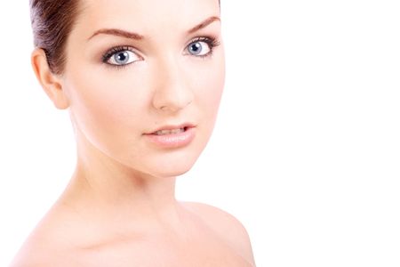 A beautiful young woman looking at the camera on a white background with copy space.の写真素材
