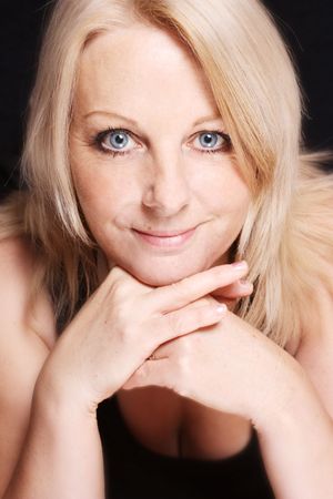 A close up of a pretty middle aged woman smiling.の写真素材