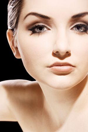 A close up of a beautiful young woman looking at the camera.の写真素材