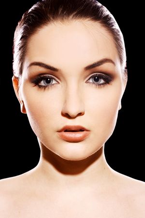 A close up of a beautiful young woman looking at the camera.の写真素材