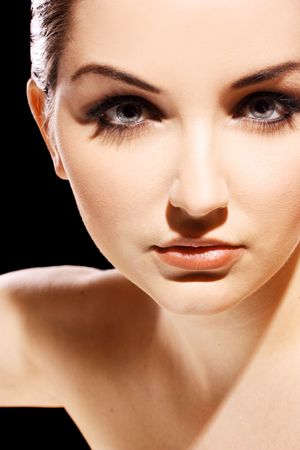 A close up of a beautiful young woman looking at the camera.の写真素材