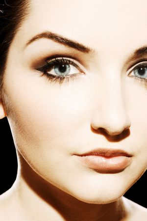 A close up of a beautiful young woman looking at the camera.の写真素材