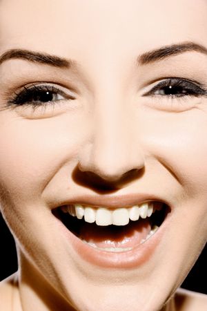 Extreme close up of a smiling/laughing woman.の写真素材