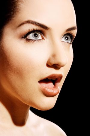 Close up of a woman pulling a shocked expression.の写真素材