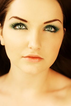 A close up of a pretty young woman looking upwards.の写真素材