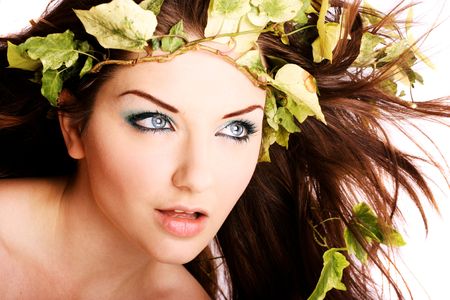 A beautiful young woman with ivy in her hair.の写真素材