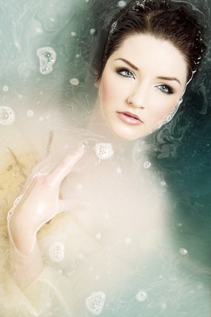 A beautiful brunette submerged in waterの写真素材