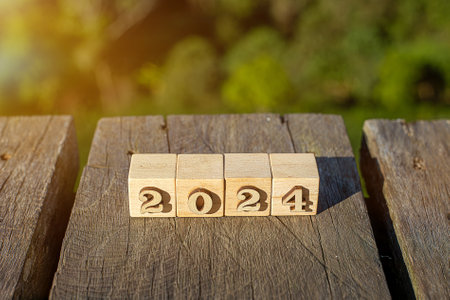Trend of 2024. Wooden cube with word 2024 with target icon. Green Business Growth Plan Ideas Analysis of company profitability, carbon offsets, growth strategies and opportunitiesの写真素材