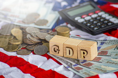 Wooden cubes with the words USA and GDP over the American flag background. Business and growth of GDP, domestic product concept. Top viewの写真素材