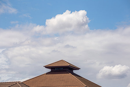 Top of building on new house with clear blue background
