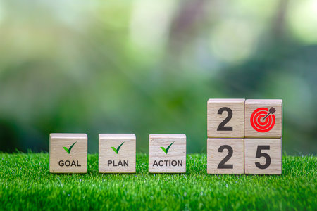 Action Plan 2025 Cube with text 2025 plans, goals, actions to list and plan for next year. Wooden cube with year 2025, plans, goals, actions, development towards success and motivation.の写真素材
