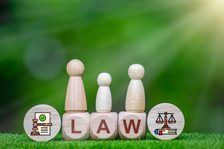 Cube with LAW text on wooden table, natural background.の写真素材