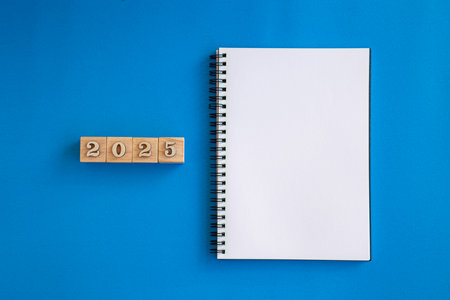 2025 New Year goal, plan, and action concepts. 2025 goals Text on Note Pad with calendar, glasses on...