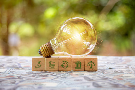 ESG, environment social governance concept, wooden block and light bulb on desk with ESG icon on virtual screen, Business cooperation for a sustainable environment, World sustainable environment.の写真素材