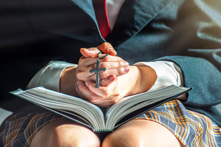 Christian life crisis prayer to god. top view of Woman holding hands pray for god blessing to wishing have a better life on a wooden table. Woman hands praying to god with the bible.の写真素材