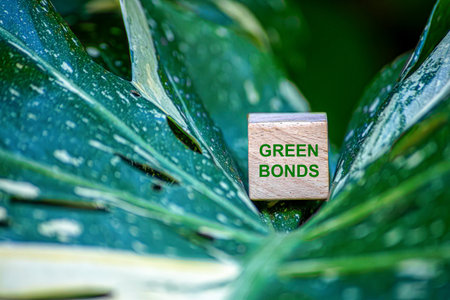 Green bonds and ESG investments, businesses recognize potential to positively impact economy and nature, against background of evolving market prices and rise of sustainable finance valuable coin.の写真素材