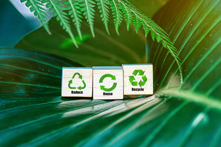 icons to reduce, recycle on wood cubes green backgroundの写真素材