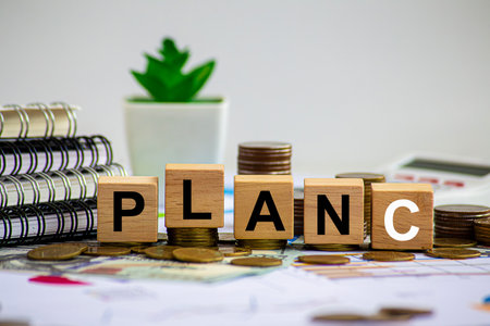 Wooden blocks with words PLAN A, PlAN B, PLAN C on violet background with copy space. Wooden tower. Business strategy, failure analysis and not give up. Business conceptの写真素材