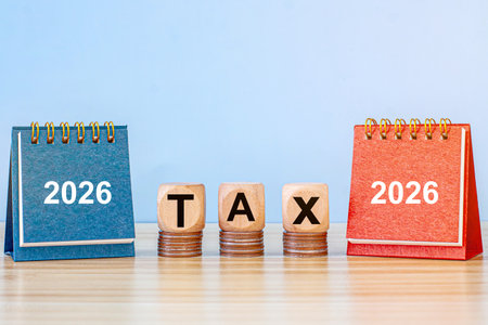 Tax and Vat 2026 Concept.Tax wooden letters on wooden cubes with 2026 on coins. income tax online return form for payment. Expenses, account, VAT, payの写真素材