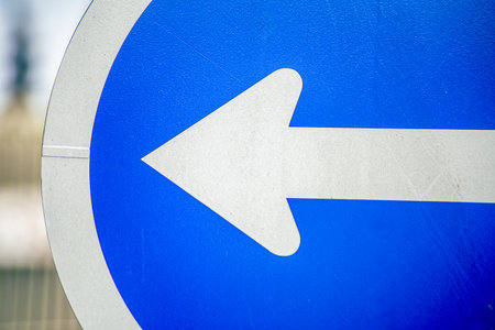 Regulatory signs, proceed in direction indicated by arrow traffic signの写真素材