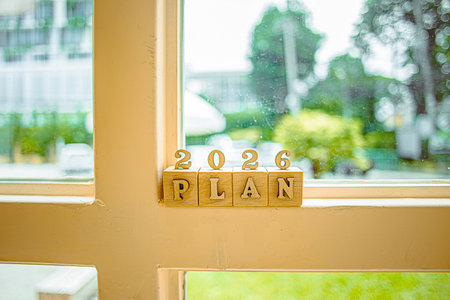 Business growth goals for 2026. Business strategies and budget planning for the new year 2026. Word plan in wooden blocks. Office work background.の写真素材