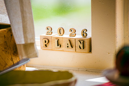 Business growth goals for 2026. Business strategies and budget planning for the new year 2026. Word plan in wooden blocks. Office work background.の写真素材