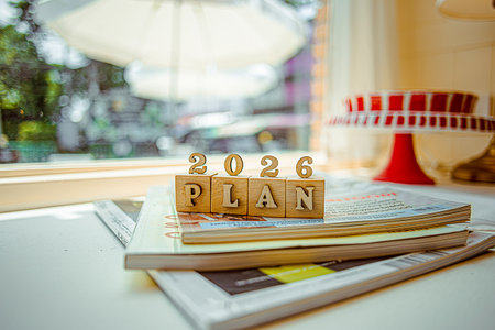 Business growth goals for 2026. Business strategies and budget planning for the new year 2026. Word plan in wooden blocks. Office work background.の写真素材