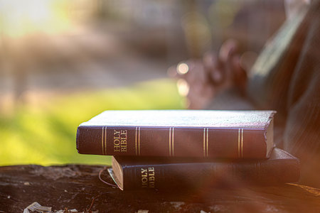 Christian Spirituality and Religious Wisdom Concept with Holy Bible Open Air Prayer and Worship with...